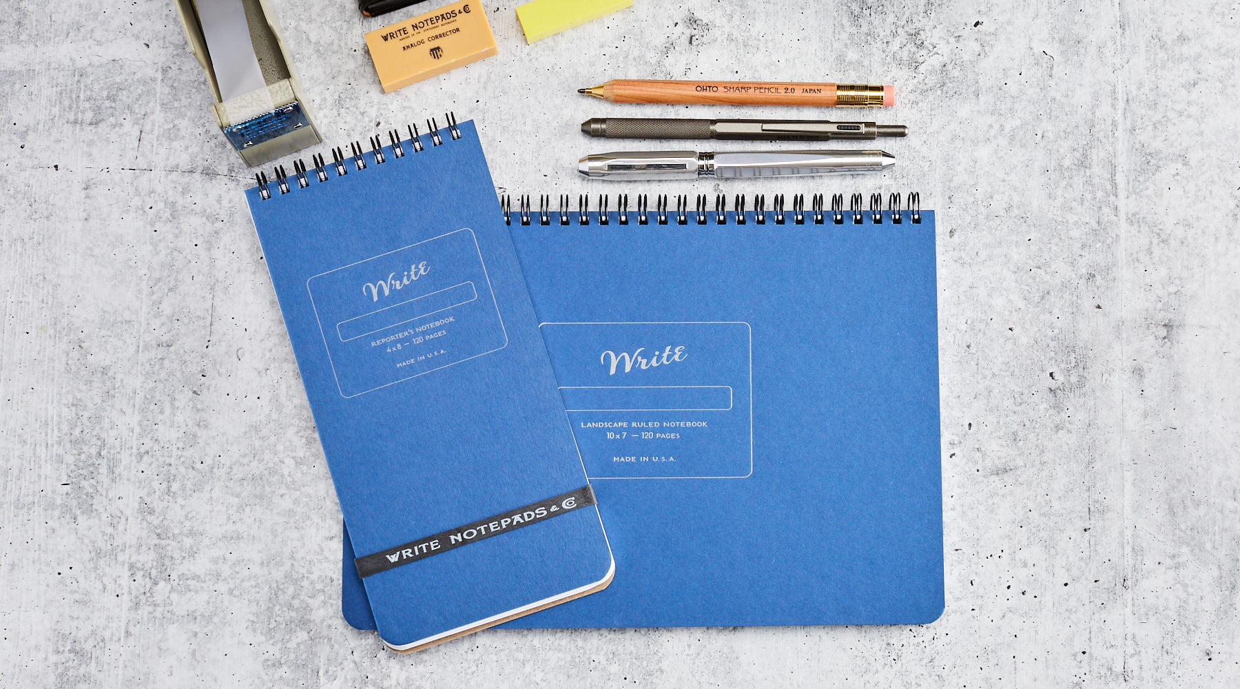 A Reporter Notebook on top of a Landscape Notebook