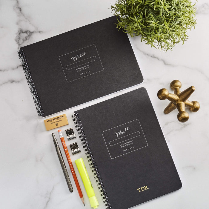 lined spiral notebook with a weekly planner